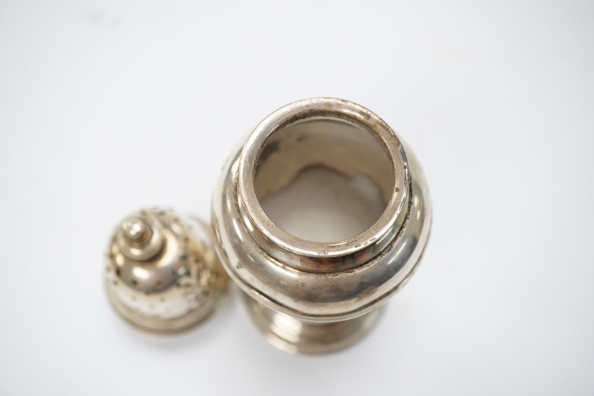 A George VI silver sugar caster, by William Comyns & Sons Ltd, London, 1936, 16.1cm, 5oz. Condition - fair